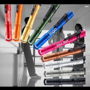 May include: Assortment of eight colorful mini flashlights with a clip. The flashlights are in various colors, including black, silver, gold, orange, pink, blue, green, and a light blue flashlight with the word "logo" printed on it. One flashlight has the word "Michael" printed on it. Another flashlight has the text "your text" printed on it.