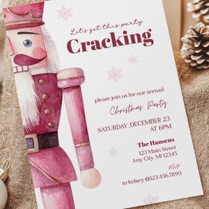 May include: A Christmas party invitation featuring a watercolor illustration of a nutcracker in shades of pink and burgundy. The invitation text reads "Let's get this party Cracking" and includes event details.