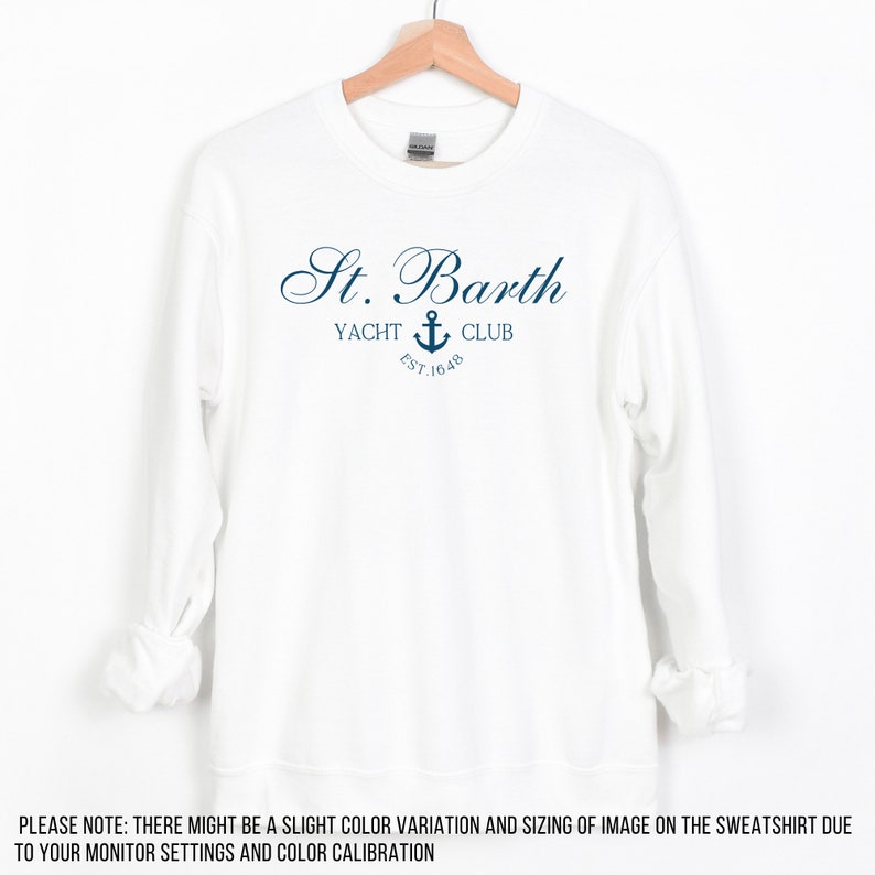 May include: White sweatshirt with a navy blue logo that says "St. Barth Yacht Club Est. 1648" with an anchor symbol.