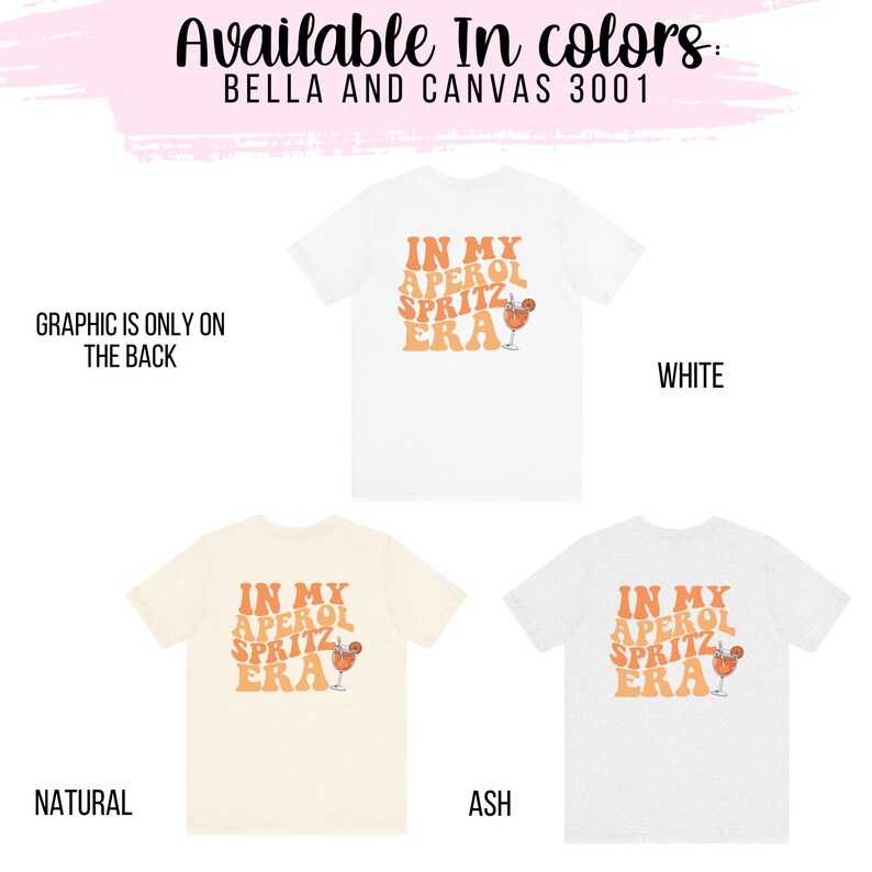 Peut inclure: Trois t-shirts avec le texte "In My Aperol Spritz Era" et un graphique d'un verre d'Aperol Spritz. Les t-shirts sont disponibles en blanc, naturel et gris.