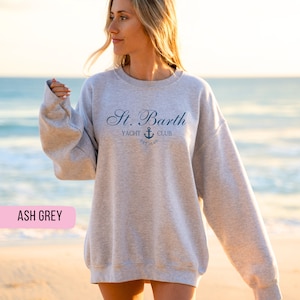 May include: Ash grey sweatshirt with the text "St. Barth Yacht Club Est. 1648" and a small anchor graphic.