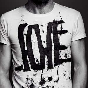 Mad Love t-shirt from Madman Collection at Occult Fashion featuring Weird and Freaky Inscription that resembles Love word styled as graffiti