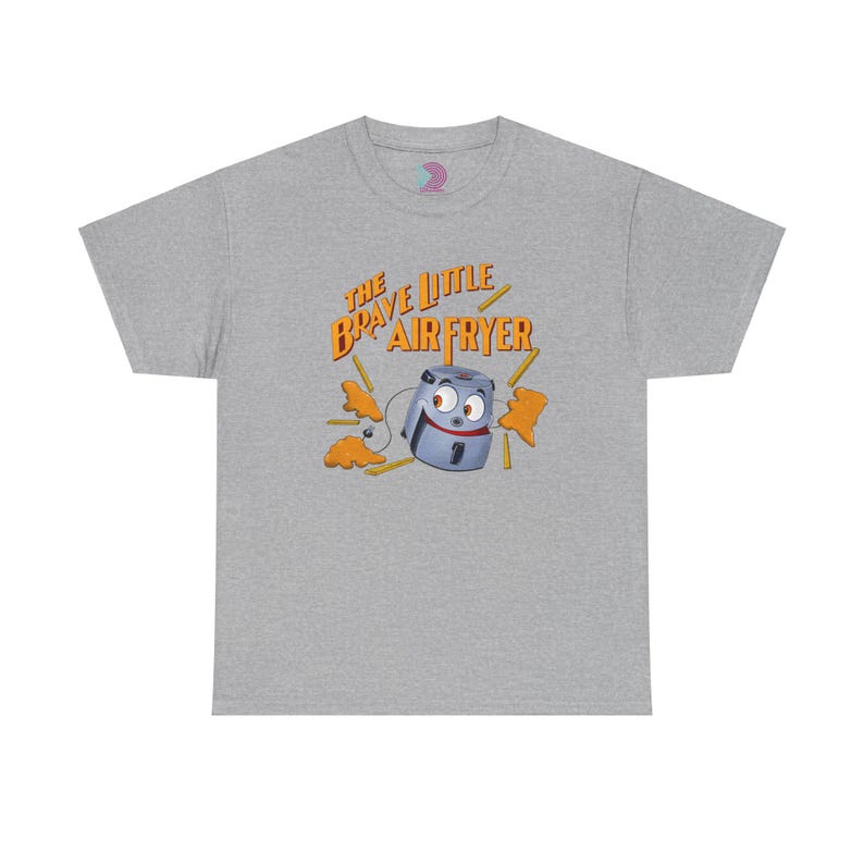 May include: A gray t-shirt with the text "The Brave Little Air Fryer" in orange and yellow letters. A cartoon air fryer with a face and arms is holding french fries.