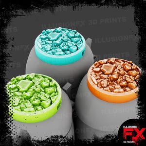 May include: Three gray, rounded, pot-like containers, each topped with a circular lid featuring a textured, rocky surface. One lid is light blue, one is bright green, and one is orange. The text ILLUSIONFX 3D PRINTS appears in the background.
