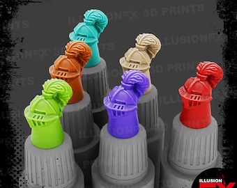 May include: A collection of colorful, miniature knight helmets in various shades including green, orange, teal, tan, purple, and red. Each helmet is perched atop a gray cylindrical base. The image has the text "ILLUSION FX 3D PRINTS".