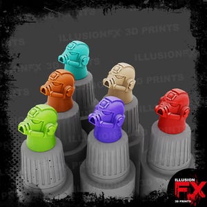 May include: A selection of brightly coloured, miniature helmet-shaped bottle stoppers in shades of teal, orange, green, purple, tan, and red. The stoppers are displayed on grey bottle tops, with the text "ILLUSION FX 3D PRINTS" visible.