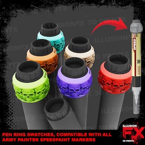 May include: A collection of colourful, skull-patterned plastic rings designed to fit onto paint markers. The rings come in various colours including lime green, orange, teal, beige, purple, and red, each featuring a detailed skull motif.