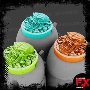 May include: Three circular gaming tokens featuring sculpted skull designs on top of rubble. One token is teal, one is lime green, and one is orange. Each token has a smooth, flat base and a detailed, textured top surface with a skull motif.