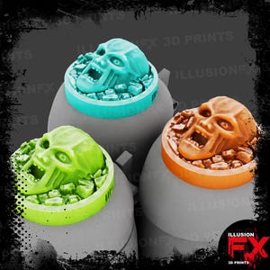 May include: Three circular gaming bases featuring a sculpted screaming face emerging from rubble. One base is light blue, one is bright green, and one is orange. Each base is mounted on a smooth, gray, dome-shaped support structure.