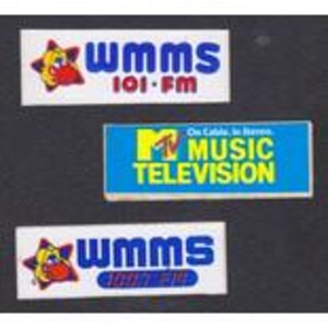 May include: Three rectangular stickers. Two stickers read "WMMS 100.7 FM" in blue text with a cartoon star logo. The third sticker reads "MTV MUSIC TELEVISION" in yellow and blue, with the text "On Cable, In Stereo."