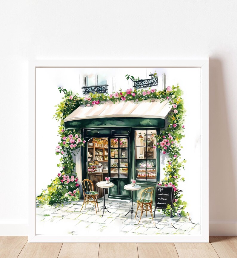 May include: A watercolor painting of a Parisian cafe with a green awning and pink flowers. The cafe has a sign that reads "Cafe gourmand, douceurs, limonade". There are two tables with chairs outside the cafe.