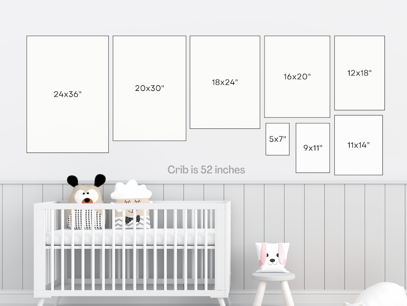 May include: A white crib with a white mattress and two stuffed animals on top. The crib is 52 inches wide. There are nine framed pictures on the wall above the crib, with measurements in inches.
