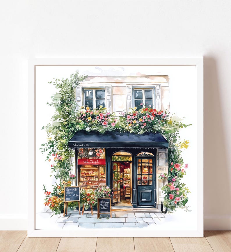 May include: A watercolor painting of a small shop with a black awning and a red sign that says "Le Jardin". The shop is surrounded by lush green plants and flowers. There are two black chalkboards with handwritten text on them.