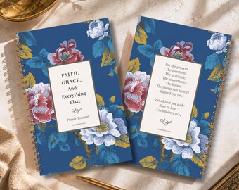 May include: Two spiral-bound prayer journals with a dark blue background featuring a floral pattern of pink, white, and yellow flowers. The left journal cover reads FAITH. GRACE. And Everything Else. The right journal cover features a religious quote.
