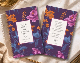 May include: Two spiral-bound prayer journals with a dark purple background featuring orange and pink floral patterns. The left journal reads: FAITH. GRACE. And Everything Else. Prayer Journal Lisa Kanova. The right journal contains religious text.