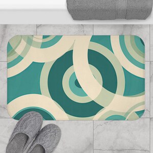 Teal, Aqua and Cream Bath Mat - non-slip bath mat featuring  overlapping circular hoop patterns in teal, aqua, and cream - Printed in USA