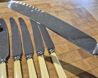Vintage Philip Ashberry and Sons "Staykeen" steak knives, manufactured in Sheffield, England, likely between the 1920s and 1950s.