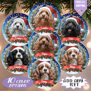 May include: Circular Christmas ornaments featuring dog portraits wearing Santa hats. Each ornament has a different dog breed and name, surrounded by a wreath design. The image also includes text that says "10 color options" and "Add any text".