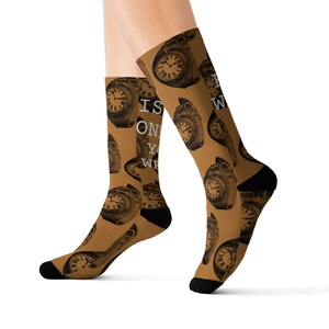 May include: A pair of brown socks with a repeating pattern of vintage clocks and the text "Time is only wasted if you're not wearing it".