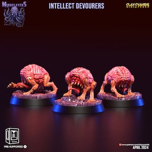 May include: Three 3D printed miniatures of brain-like creatures with open mouths and tongues sticking out. The creatures are painted in shades of pink and orange and are standing on black bases. The miniatures are labeled "Intellect Devourers" and are part of the "Mindflayers" collection by Clay Cyanide Miniatures.