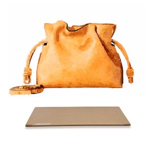 May include: A light brown leather bucket bag with a drawstring closure and a knotted handle. The bag is sitting on a light brown surface with the text "AL BOUTIQUE" printed on it.