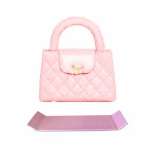 May include: A pink quilted handbag with a gold clasp and a matching pink strap.