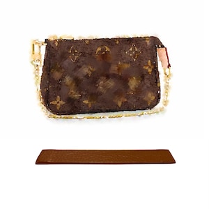 May include: A brown leather purse with a gold chain strap and a brown leather strap. The purse has a monogram pattern.