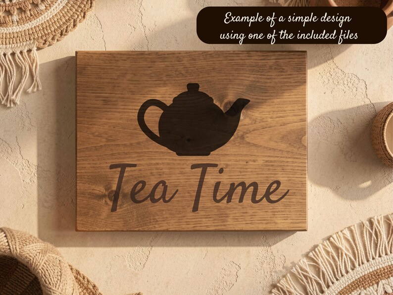 May include: Wooden sign with a dark teapot silhouette and the words "Tea Time" in a cursive font. The sign is made of light brown wood and has a dark brown border. The text "Example of a simple design using one of the included files" is at the top.