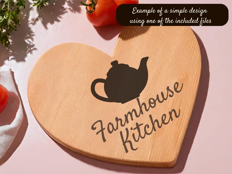 May include: A heart-shaped wooden cutting board with a black teapot silhouette and the words "Farmhouse Kitchen" in a script font. The text "Example of a simple design using one of the included files" is in a black rectangle.