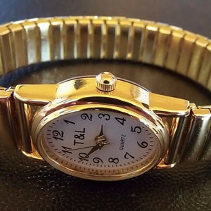 Quarz Uhr Zugband Stretch Armband Edelstahl Batterie Stretcharmband gold Damen Mädchen unisex flexibles Armband geprüft & neu Armbanduhr Bild 2