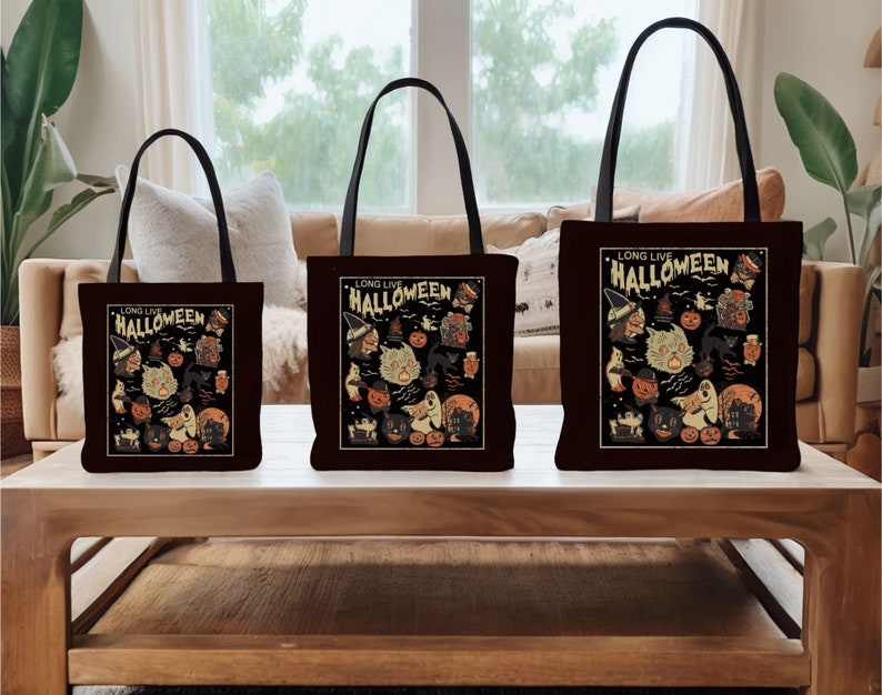 May include: Three black tote bags with white handles. Each bag features a different size and has a vintage Halloween design with the text "Long Live Halloween" and a variety of spooky characters.