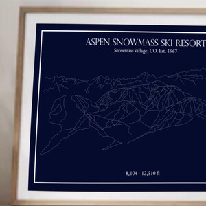 May include: A white line art map of the Aspen Snowmass Ski Resort on a dark blue background. The text "Aspen Snowmass Ski Resort" is at the top of the map, with the text "Snowmass Village, CO. Est. 1967" below it. The text "8,104 - 12,510 ft" is at the bottom of the map.