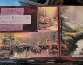 2 new sealed Deluxe Set Thomas Kinkade Painter of Light 3 Jigsaw Puzzles in each
