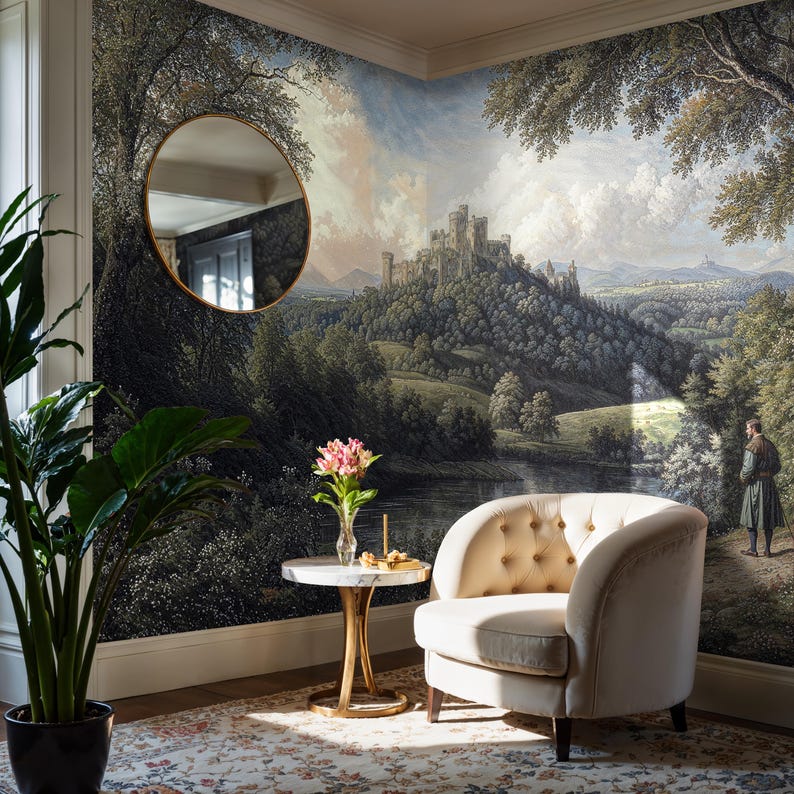 Elegant corner with a tufted chair and medieval landscape mural wallpaper, featuring a distant castle, lush trees, and a reflective lake.