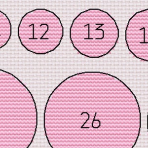 May include: A white background with pink circles containing numbers 11, 12, 13, 14, 26, and 27.