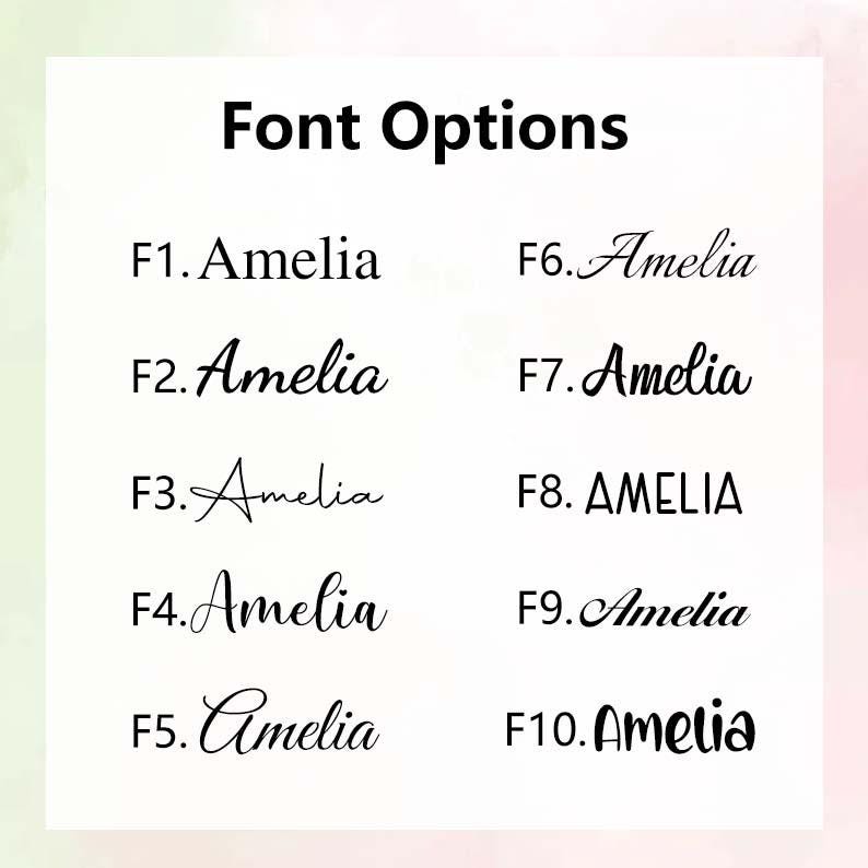 May include: A white background displays "Font Options" in bold black text. Below, ten font options are shown, each labeled F1 through F10, with the name "Amelia" written in various styles, including a bold, all-caps version.