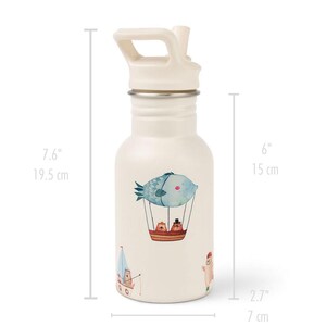 May include: A cream-colored water bottle with a flip-top lid. The bottle features a whimsical design of a fish in a hot air balloon, along with other nautical illustrations. The bottle is 7.6 inches tall and 2.7 inches wide.