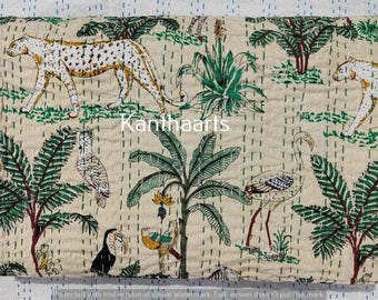 May include: Cream-colored textile with a jungle scene featuring leopards, birds, and lush green foliage. The design includes palm trees, toucans, and other exotic animals. The text "Kanthaarts" is visible.