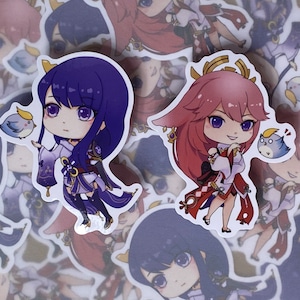 May include: Two anime-style character stickers, one with purple hair and a blue bird, the other with pink hair and a blue bird. Both stickers have a white background.