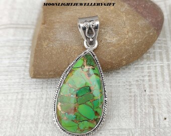 May include: A teardrop-shaped pendant featuring a vibrant green stone with copper-colored veining, set in a polished silver frame with a twisted rope border and a decorative silver bail. The text MOONLIGHTJEWELLERYGIFT is visible in the background.