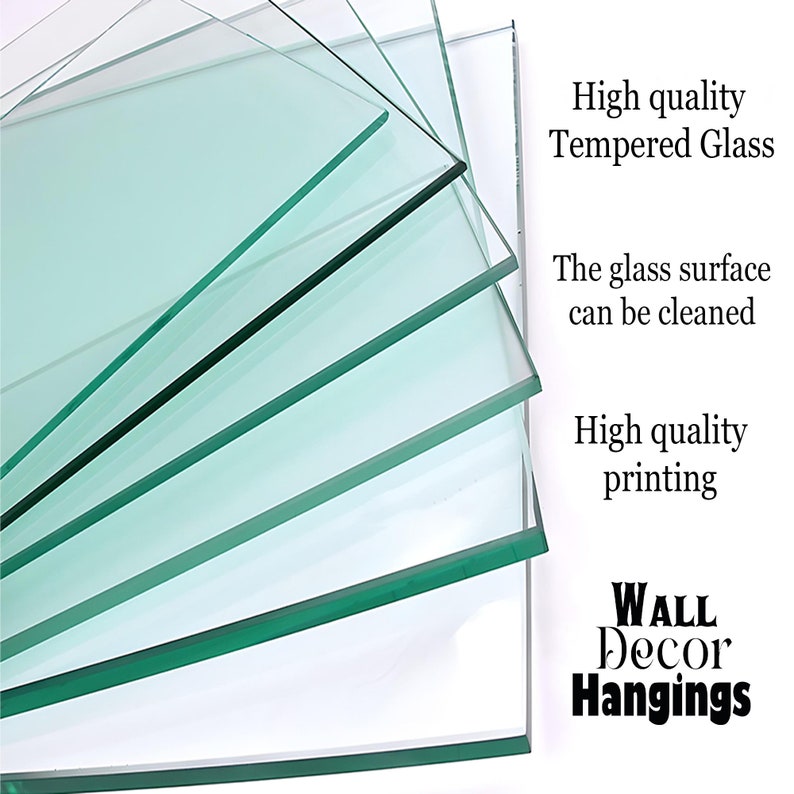 May include: Stack of clear tempered glass panels with a green tint. The glass is smooth and reflective. The text "High quality Tempered Glass" is printed on the right side of the image. The text "The glass surface can be cleaned" is printed below the first line of text. The text "High quality printing" is printed below the second line of text. The text "WALL Decor Hangings" is printed in large letters at the bottom of the image.