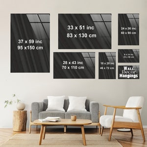 May include: A set of five black and white abstract wall decor hangings with different sizes and dimensions. The hangings feature a blurred, textured background with a window pane design. The dimensions of each hanging are listed in inches and centimeters.