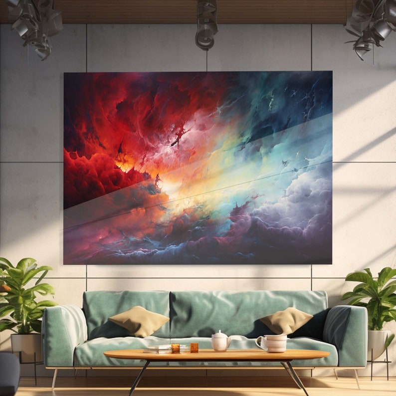 May include: Abstract painting of a colorful sky with red, orange, yellow, blue, and purple clouds. The painting is on a canvas and is framed in a modern style.