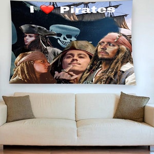 May include: A tapestry featuring a collage of characters from the Pirates of the Caribbean movie franchise. The tapestry has a black background with a red heart and the text "I &hearts; Pirates".