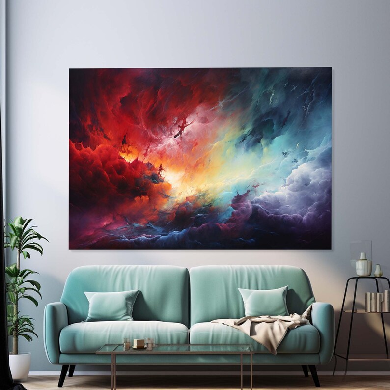 May include: Abstract painting with a colorful, swirling sky. The sky is a mix of red, orange, yellow, blue, and purple. The painting is framed and hanging on a wall above a teal sofa.