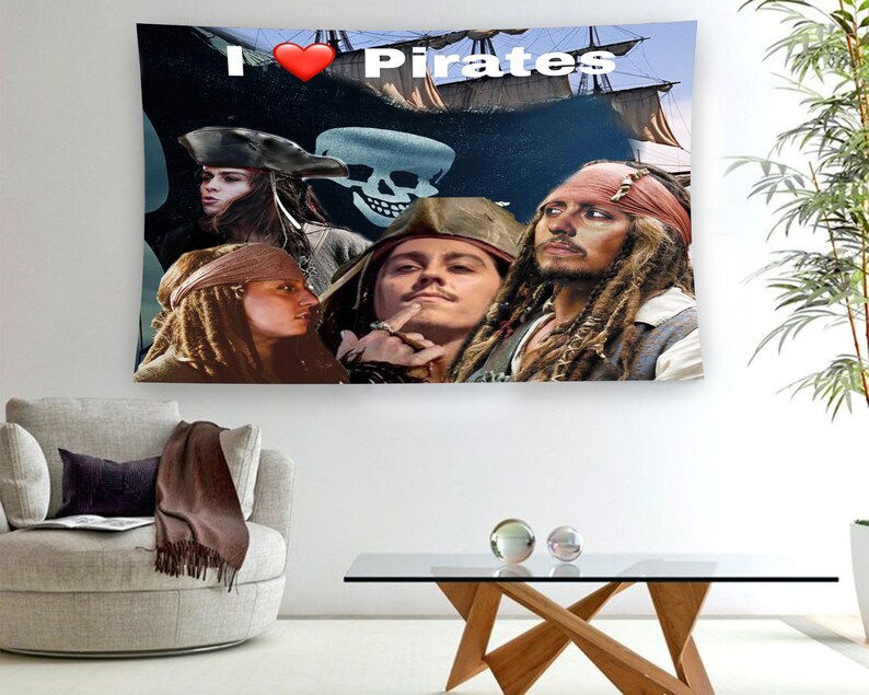 May include: A tapestry featuring a collage of pirates with the text "I &hearts; Pirates". The tapestry includes a red heart, a skull and crossbones, and four pirates with long hair and facial hair.