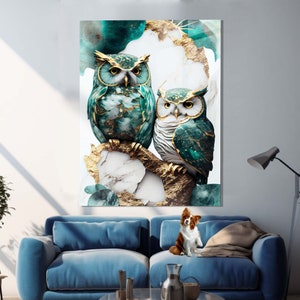 May include: Two owls with gold accents perched on a branch with a marble and gold background. The owls are green and blue with gold accents. The background is a mix of white marble and gold.