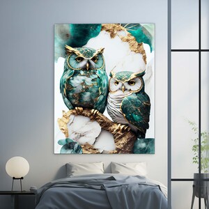 May include: Two green and gold owls perched on a branch with a white marble and gold background. The owls have intricate details and a textured appearance.