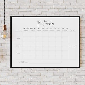 May include: A black and white printable calendar with the text "The Jacobsens" at the top. The calendar is divided into months, with each month having a grid of squares for each day. There are also columns for "To Do" and "Groceries".
