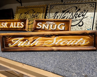 Irish stouts , traditionally hand lettered wooden pub/bar/mancave sign .
